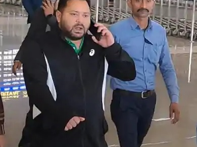 Tejashwi Yadav at Patna Airport avoiding media questions after returning from Delhi.