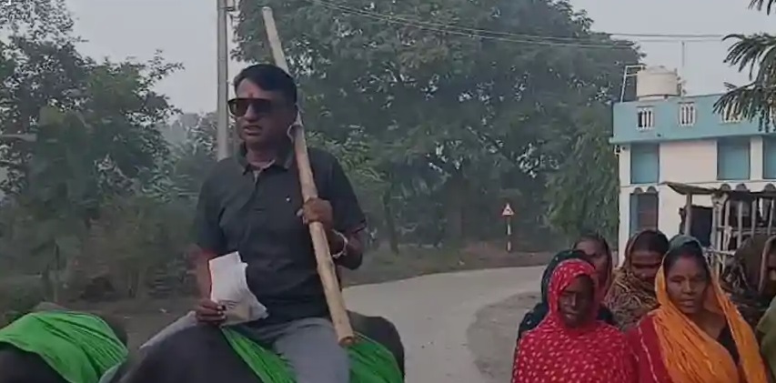 Kedar Yadav rides a buffalo to cast his vote in Bhagwanpur, Vaishali during Bihar Election 2025